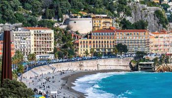 Nice view with blue sea and sunny weather, city and tourists people, promenade